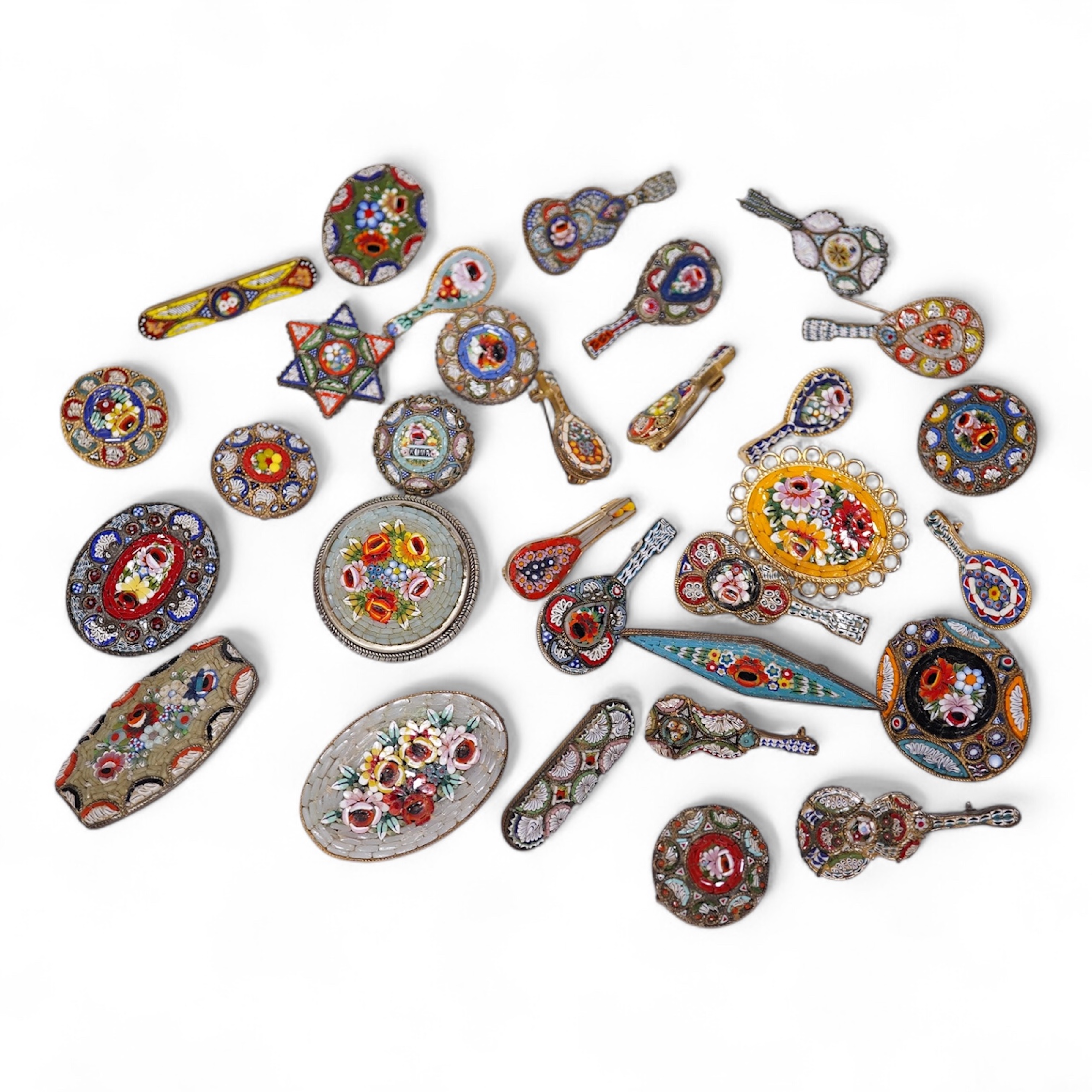 A collection of thirty-one micro-mosaic brooches, including fourteen mixed guitar and banjo shaped brooches, six large oval brooches and seven smaller brooches, three long brooches and a star shaped brooch. Condition - g
